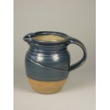 Charles Bound (b.1939) , a blue glazed stoneware jug, height 13 cm