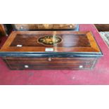 A 19th century Swiss music box in a faux rosewood and boxwood inlaid case, single comb movement