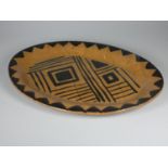 Unknown, a brown glazed clay serving plate with black detail, diameter 40 cm