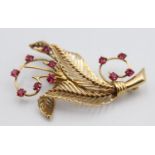 A French gold and synthetic ruby floral spray brooch, bearing control marks, 5 x 3 cm.