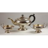 A silver three piece tea service, Birmingham 1931, of pedestal form with gadroon border, 29 oz.