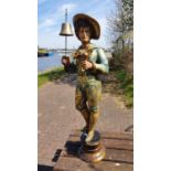 A fairground organ figure of a man holding a bell, back cut out to mount, brass bell,