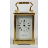A large English brass carriage time piece, the white enamel dial signed Mappin & Webb, the 11