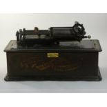 An Edison phonograph c1905 serial number H107518, no trumpet, not working, together with 3 records