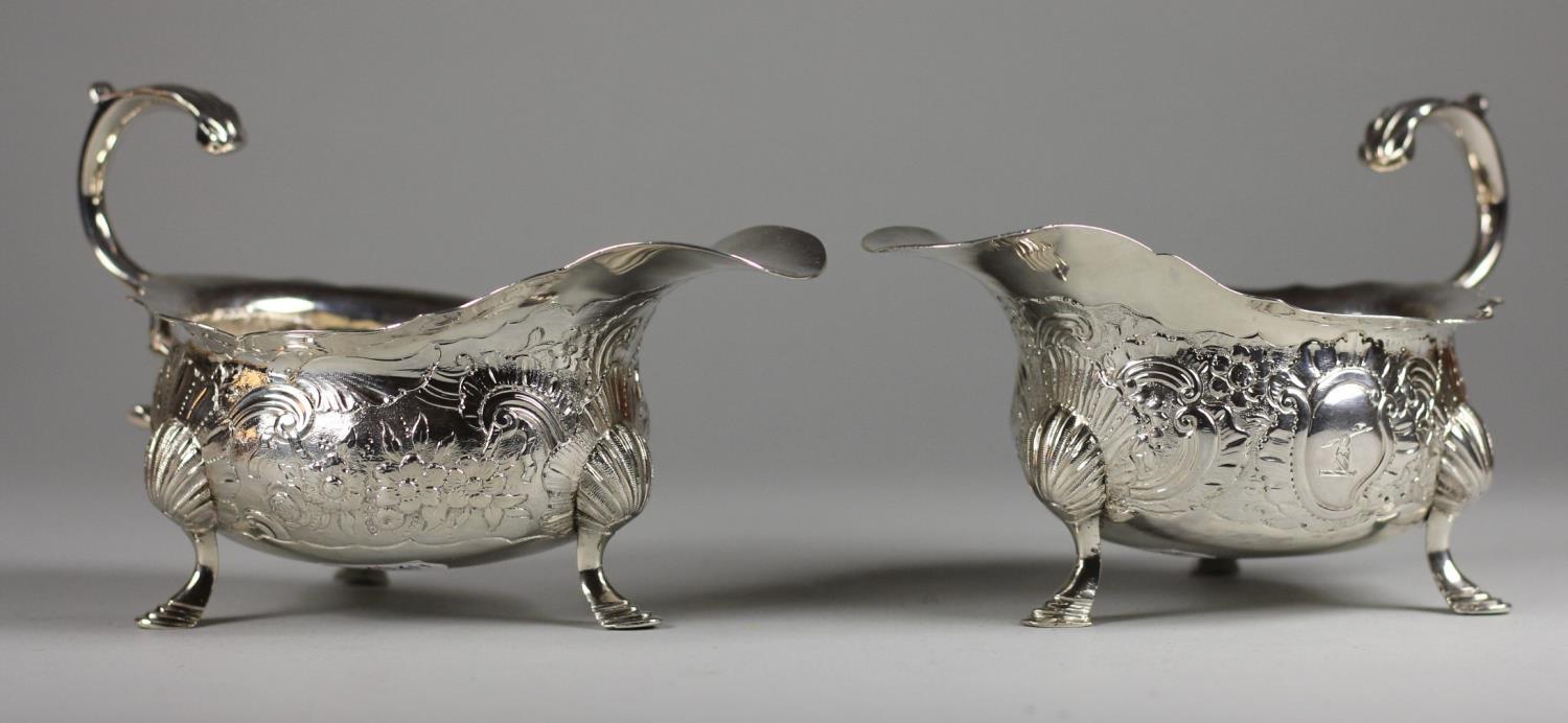 A matched George II and Victorian pair of gravy boats, by ?.K, London 1746 and Thomas Hughes, London