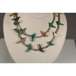 A Navaho bird two row necklace, c.1980's, composed of carved semi precious stones with turquoise