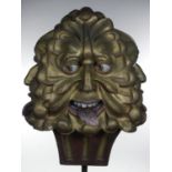 A Victorian carved and gilt painted four face mask finial, 30 cm.