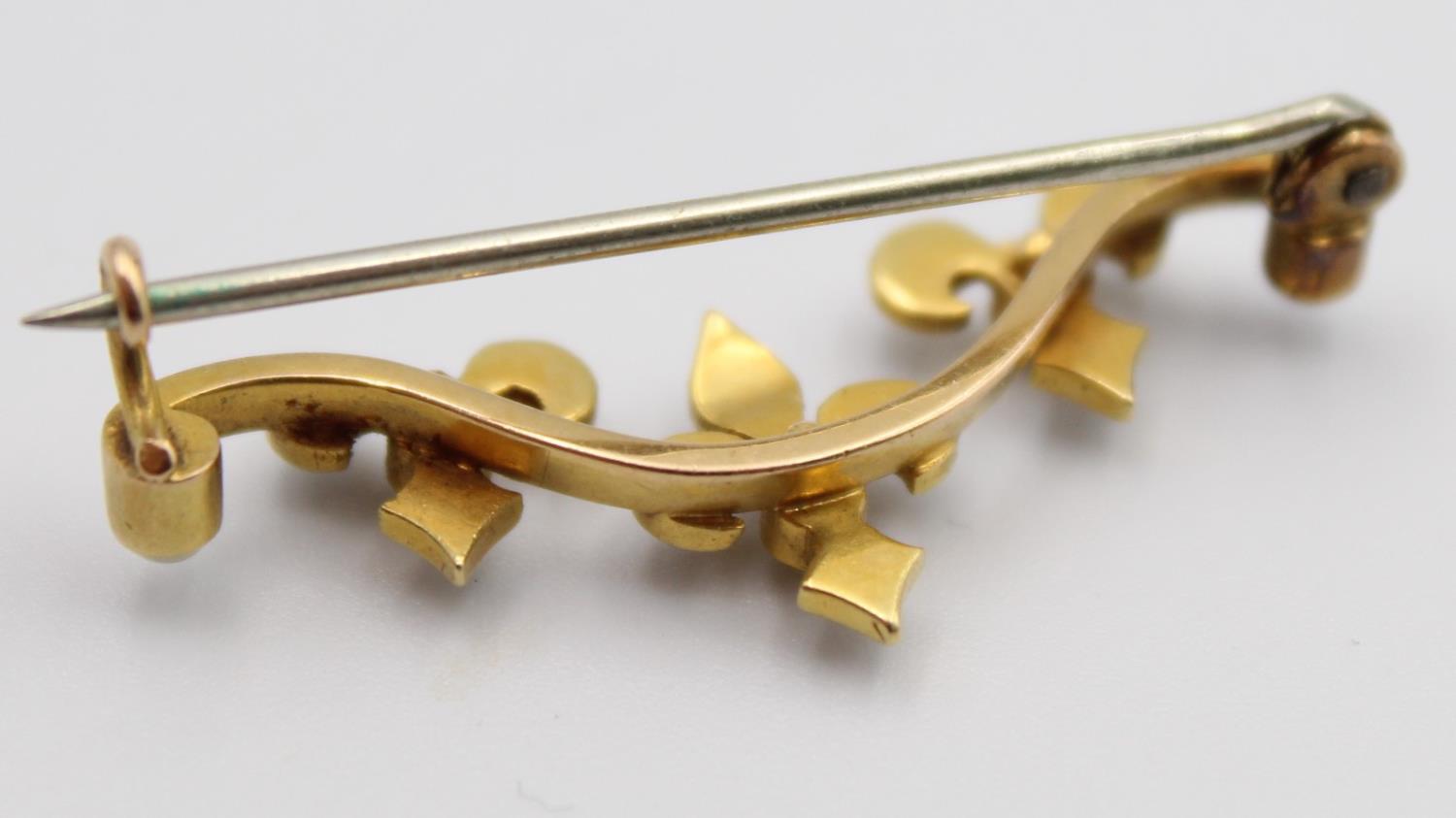 A Victorian gold and half pearl bar brooch, with trefoil designs and a 9ct gold peridot and pearl - Image 10 of 11