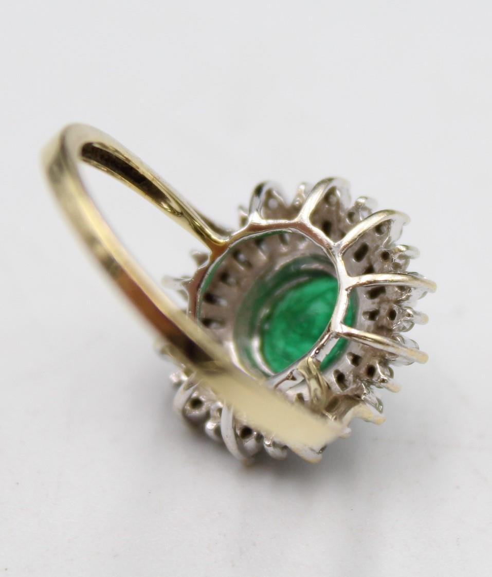 A 9ct gold emerald and diamond cluster ring, the claw set oval stone bordered by baguette and - Image 4 of 5