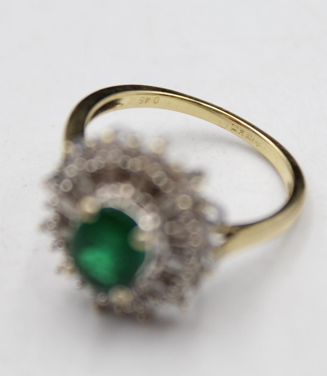 A 9ct gold emerald and diamond cluster ring, the claw set oval stone bordered by baguette and - Image 5 of 5