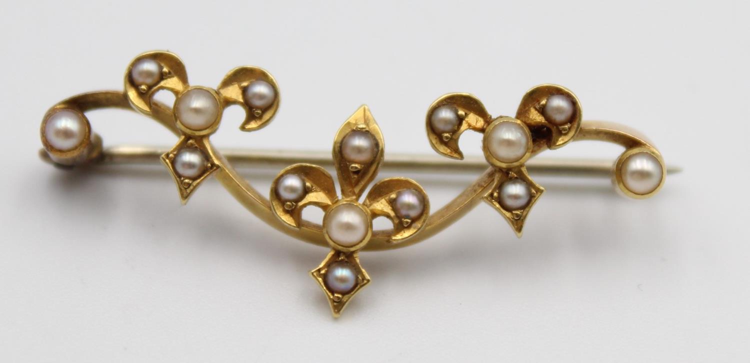 A Victorian gold and half pearl bar brooch, with trefoil designs and a 9ct gold peridot and pearl - Image 9 of 11