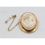 A Victorian 9ct gold mounted conch shell cameo brooch, depicting a lady, 3 x 2.5 cm.