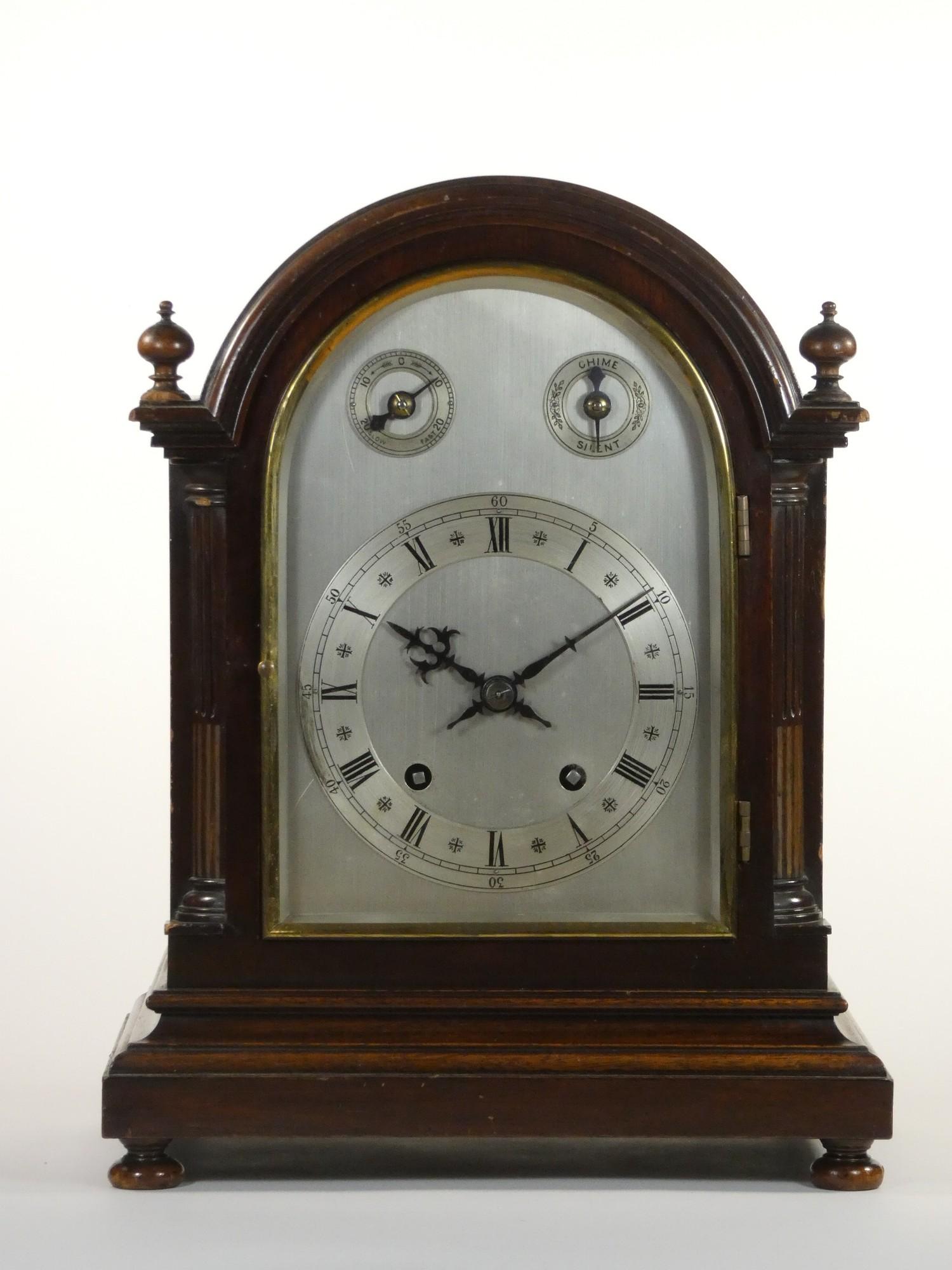 An Edwardian mahogany mantle clock, with silvered dial, subsidiary chime/silent and fast/slow dials,