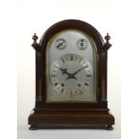 An Edwardian mahogany mantle clock, with silvered dial, subsidiary chime/silent and fast/slow dials,