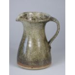 Unknown, a green stoneware water jug with darker green detail, height 16.8 cm