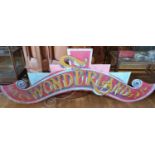 A painted wood and backlit Wonderland sign, 236 cm.