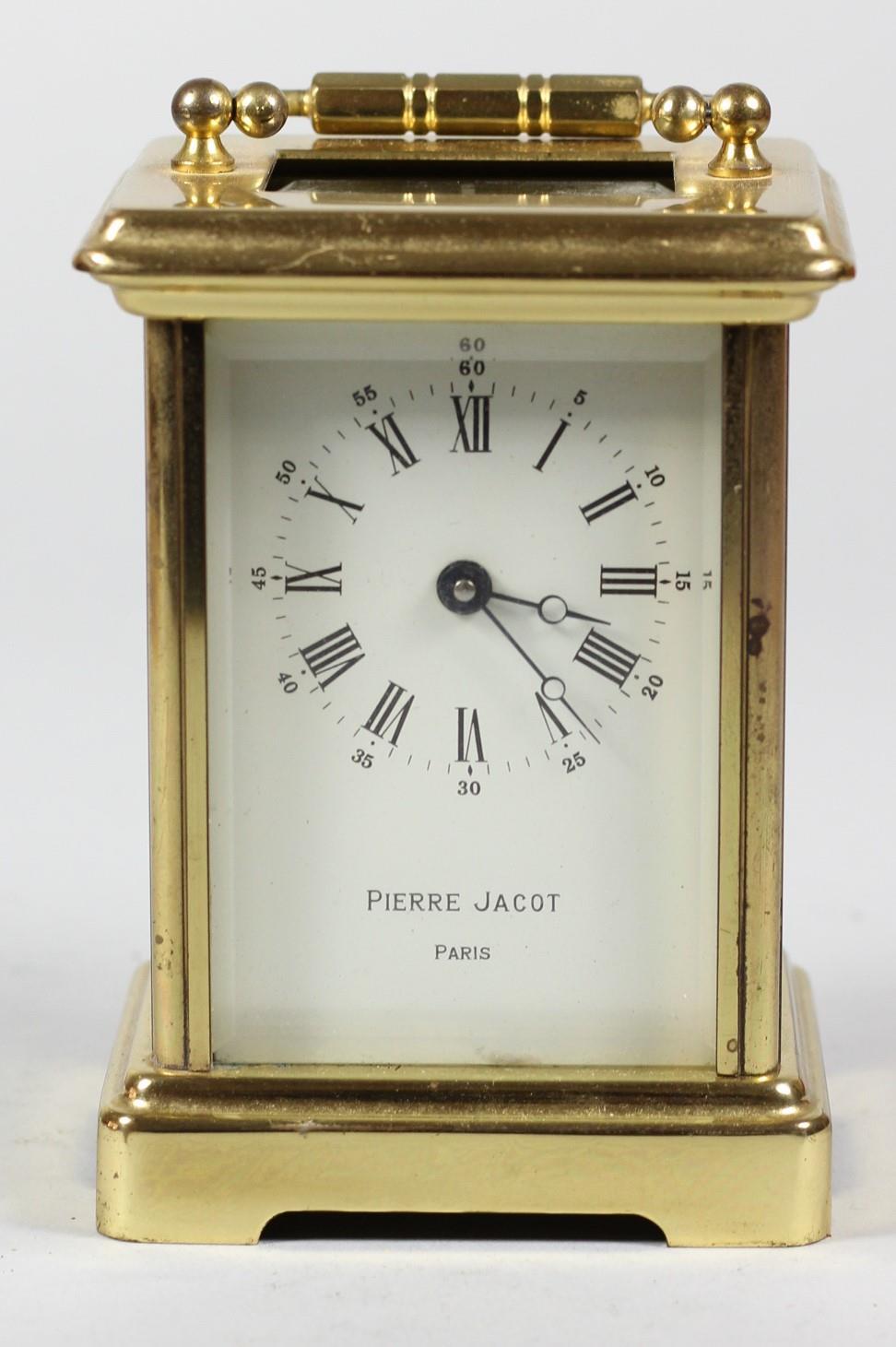 A French brass carriage time piece, the white enamel dial signed Pierre Jacot, Paris, height with