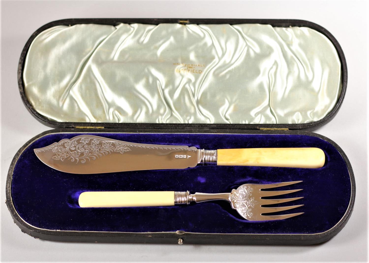 A silver fish knife and fork, By Walker & Hall, Sheffield 1910, with engraved blade and tings, plain