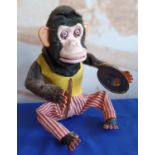 A Japanese battery operated mechanical monkey playing the cymbals, 28 cm.