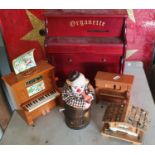 Seven various musical boxes, to include a sad clown in a barrel