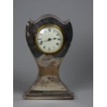 An Edwardian silver cased mantle clock, marks worn, white enamel dial, with Roman numerals, height