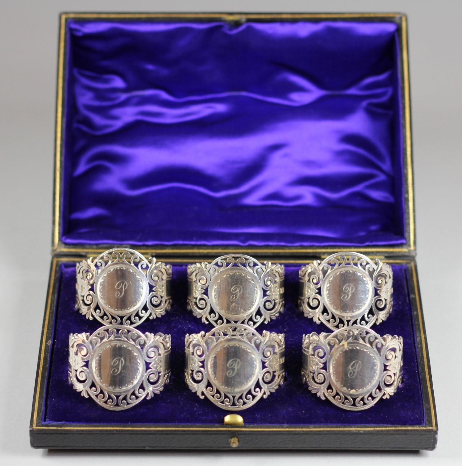 An Edwardian silver set of six napkin rings, Sheffield 1908, of pierced and engraved form, each - Image 2 of 3