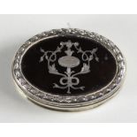 An Edwardian silver and tortoiseshell pill box, Birmingham 1908, of oval form with pull off cover, 5