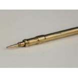 A Victorian gold case propelling pencil, with engine turned decoration, bloodstone terminal, 11 cm