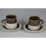 A Colin Pearson teacup and saucer pair, stoneware with tenmoku glaze, height 7 cm