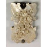 A Victorian silver mounted carved mother of pearl aide memoire, the front carved with a bouquet of