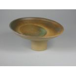Unknown, a collection of six stoneware display stands with green, brown, and yellow designs,