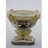 A 19th century Crown Derby pedestal dish, with pierced mask border, number 68, lacking cover, with
