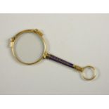 A pair of gold plated and enamel lorgnettes, the bridge stamped 1/10, anchor, G, length 10.5 cm.