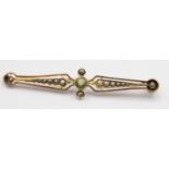 A Victorian gold and half pearl bar brooch, with trefoil designs and a 9ct gold peridot and pearl