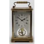 A German brass carriage time piece, the white enamel dial signed Schatz, 8 day, Made in Germany,