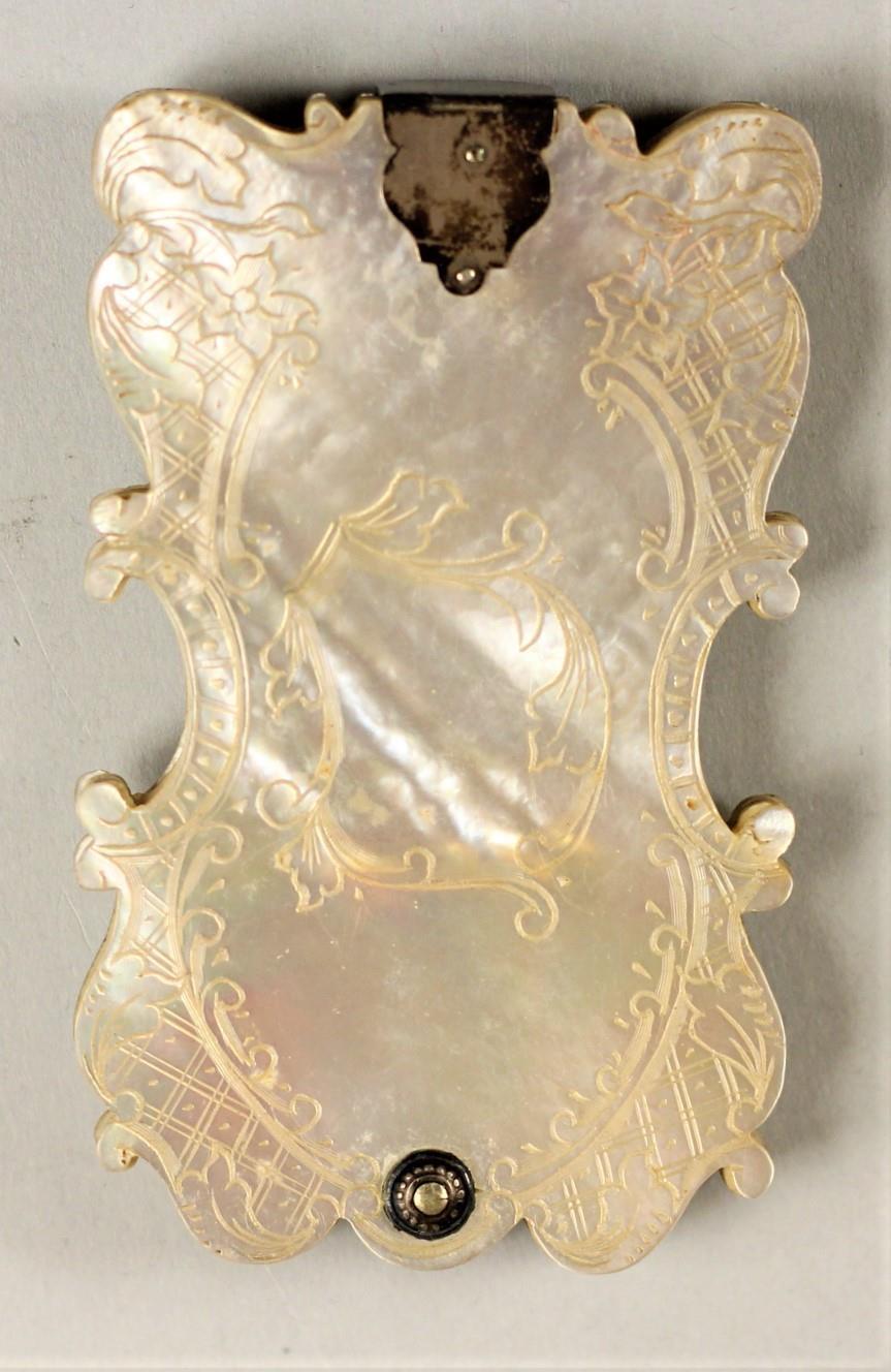 A Victorian silver mounted carved mother of pearl aide memoire, the front carved with a bouquet of - Image 2 of 3