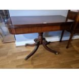 A Victorian mahogany fold over swivel pedestal side table, 100 x 50 (100 extended) x 70 cm.