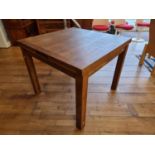 An oak swivel top extending dining table, 90 x 90 (extending to 180) x 77 cm.