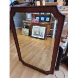 An oak framed bevelled glass mirror