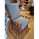 An Edwardian oak reclining armchair, with removeable base and back cushions