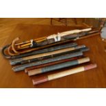 A collection of walking sticks, early umbrellas and truncheons