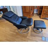 An Ikea reclining swivel armchair, model 200.182.64, together with a matching foot stool, 800.182.61