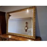 A gilt framed bevelled mirror, 87 x 112 cm.