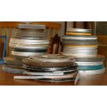 A large collection of 8mm film reels including- Laurel & Hardy, Blockheads, Tom & Jerry, Loony