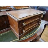 A Victorian stained pine apprentice chest of two long drawers, 42 x 25 x 23 cm.