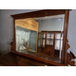 An Edwardian mahogany framed bevelled over mantle mirror, 130 x 84 cm