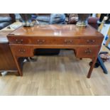 A mahogany desk, with three frieze drawers and two pedestal drawers, 120 x 57 x 77 cm.