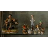 A Capodimonte ceramic model of a man feeding birds, together with Beswick horses, Royal Crown