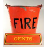 A red railway fire bucket with hinged half-lid, together with a small yellow and red 'GENTS' sign