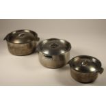 Three stainless steel cooking pots, each marked to base and lid 'LMS HOTELS'